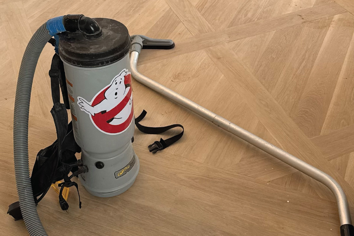 Dust containment sanding equipment in use